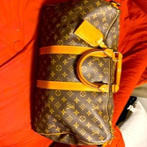 Poshmark authenticated Louis Vuitton 45cm bandolier.